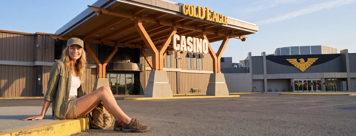 Woman by the Gold Eagle Casino entrance canopy